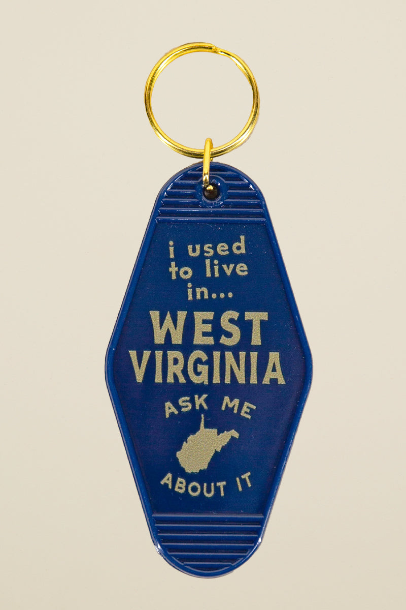 West Virginia motel keychain from Kin Ship Goods – vintage-style blue key tag with 'I used to live in West Virginia' design. Perfect for WV nostalgia.