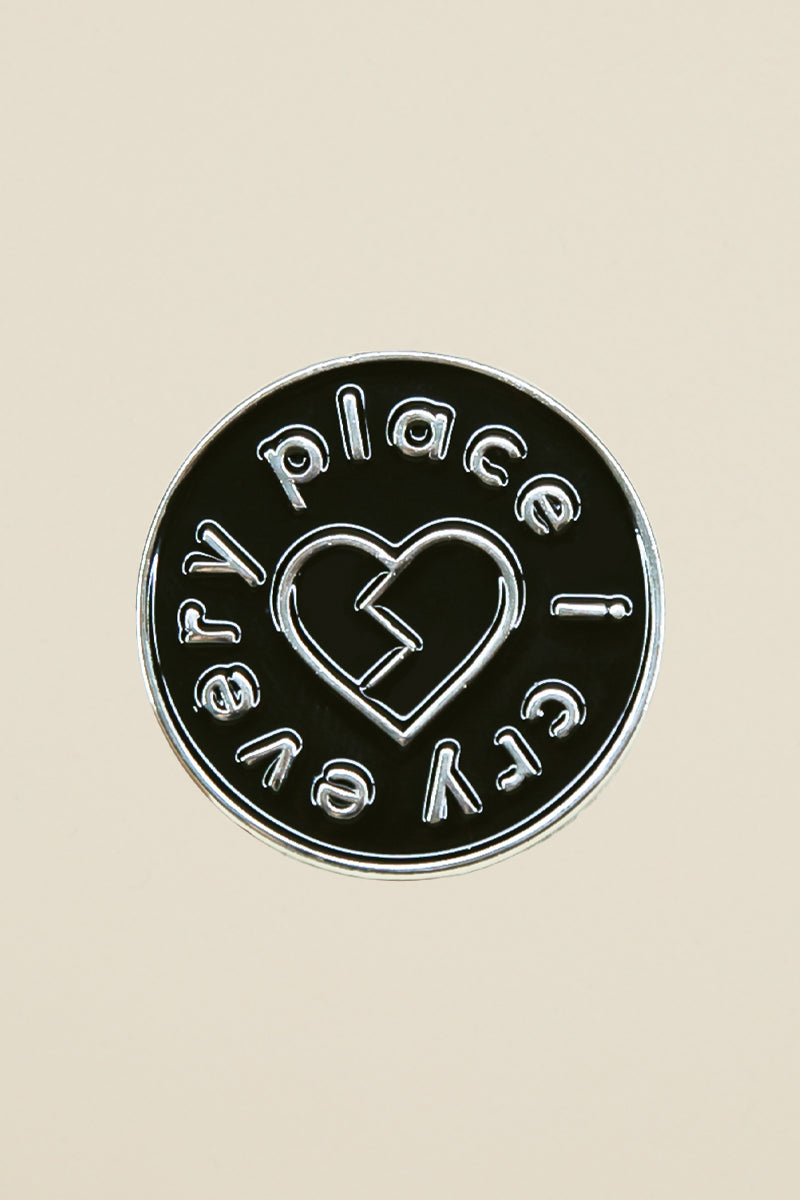 I Cry Every Place enamel pin from Kin Ship Goods – official Off Book podcast merch with broken heart design. Perfect for fans, jackets, and bags.