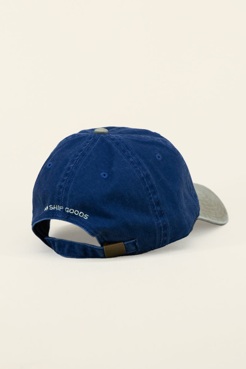 Kin Ship Goods lantern hat with navy crown and khaki brim—embroidered Appalachian lantern logo on classic cotton dad cap.
