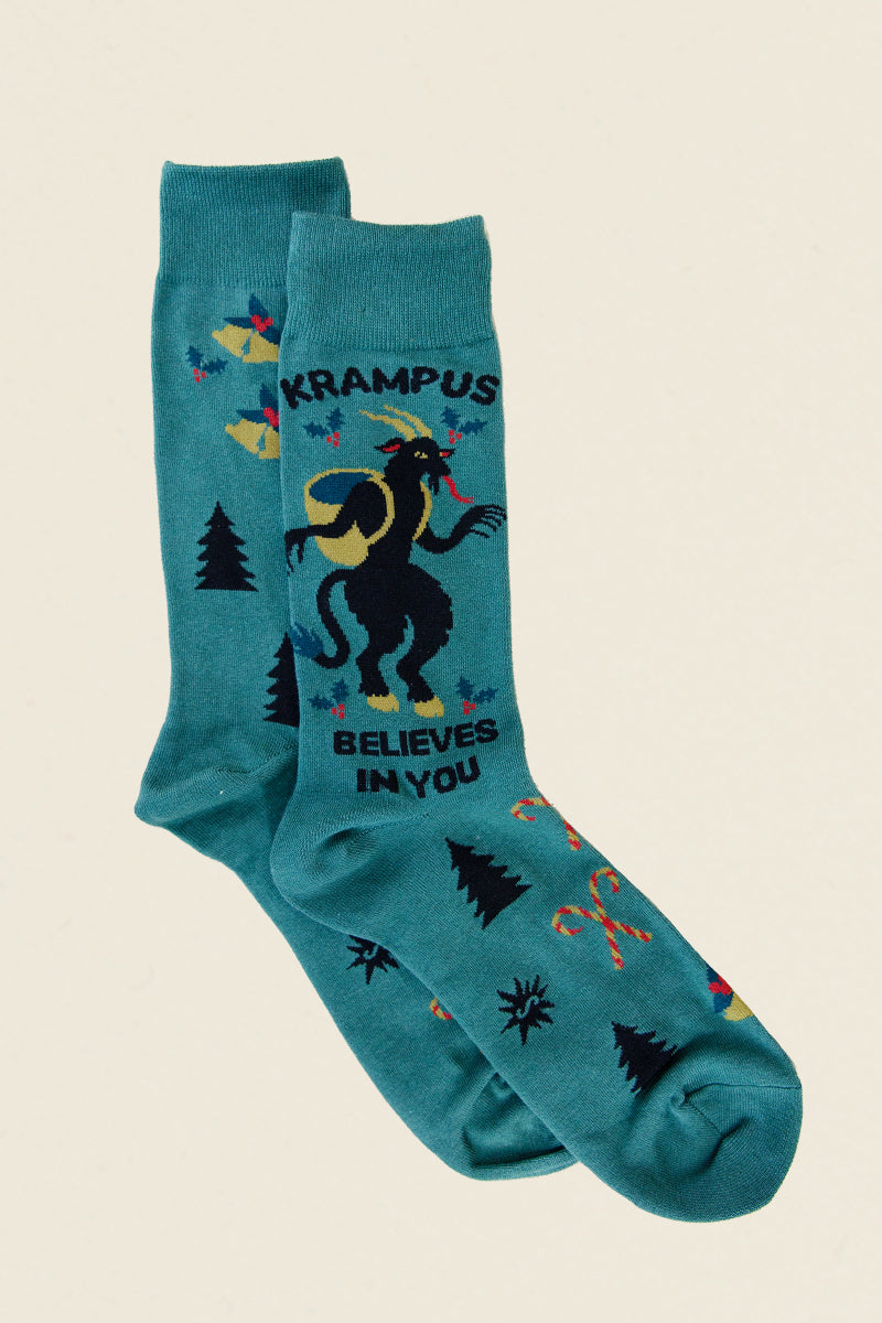 Kin Ship Goods Krampus Believes in You socks, teal holiday socks with folklore design, candy canes and trees