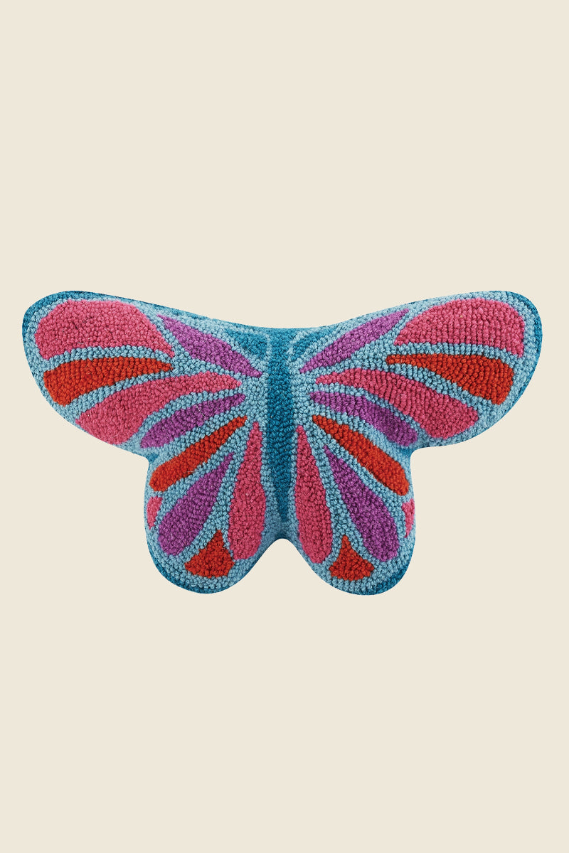 Kin Ship Goods butterfly hook pillow with pink, red, purple, and blue wings—colorful butterfly-shaped accent pillow for cozy decor.