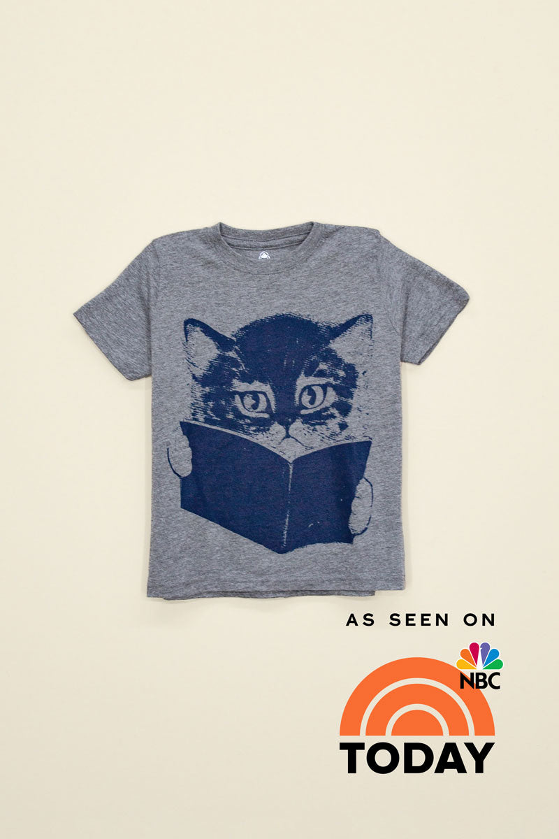Kin Ship Goods kids tee in heather gray with navy cat reading a book graphic, as seen on NBC’s TODAY Show.