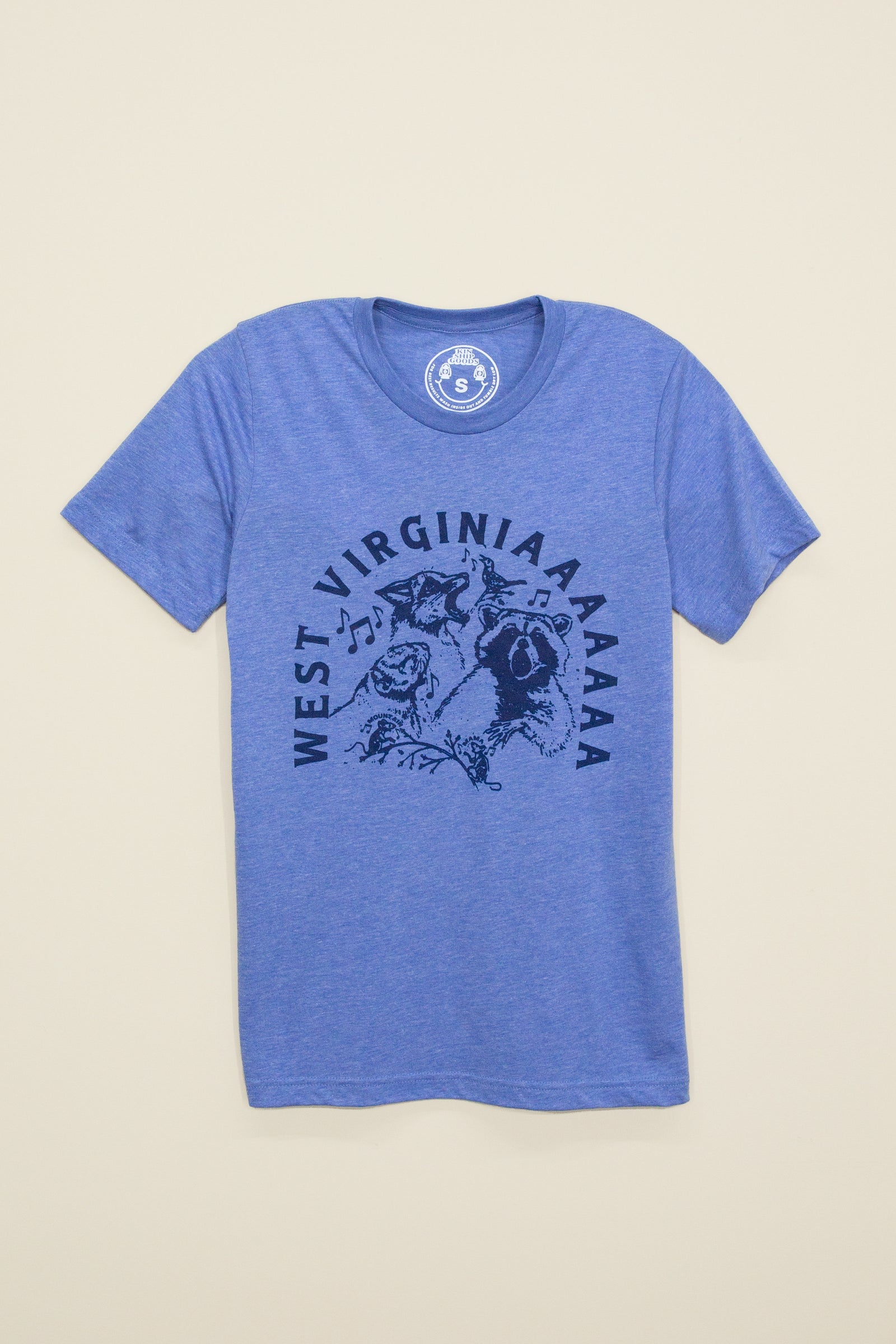 Kin Ship Goods heather blue country critters tee with howling Appalachian animals and ‘West Virginiaaaaa’ text, perfect for nature lovers and locals.