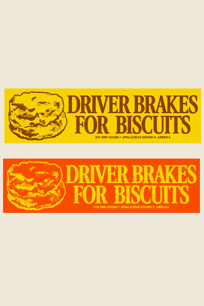 Kin Ship Goods “Driver Brakes for Biscuits” bumper sticker in yellow and orange—screen printed in Charleston, West Virginia.
