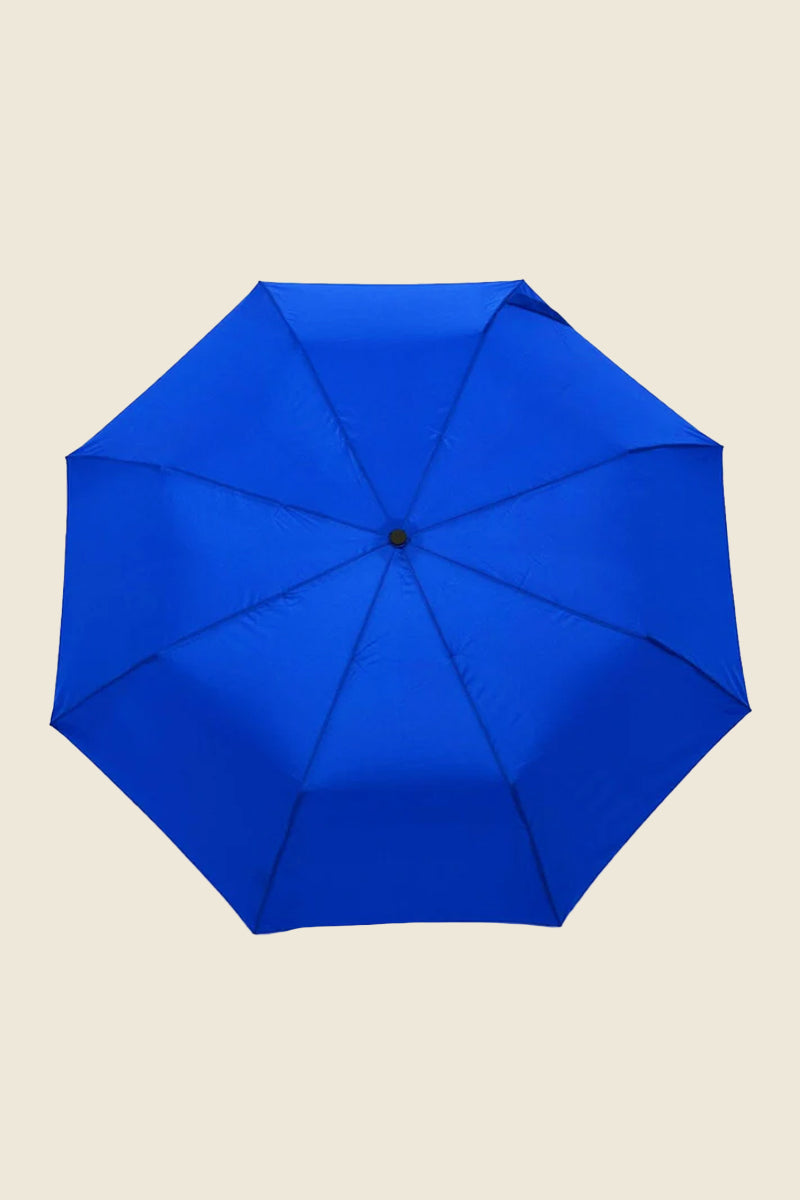 Kin Ship Goods royal blue umbrella with wooden duck handle and matching blue beak—fun, compact, and practical rainy day essential.
