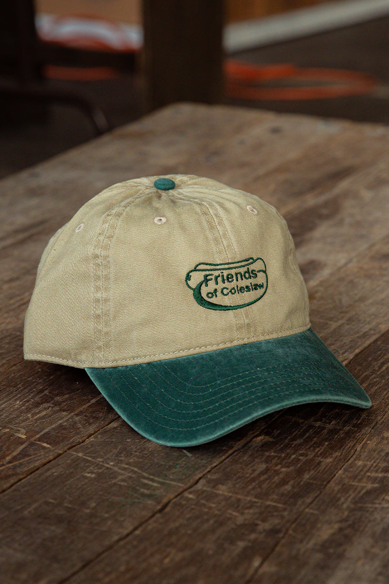Kin Ship Goods Friends of Coleslaw dad hat with green embroidered logo—khaki and forest green cotton cap with Appalachian flair.