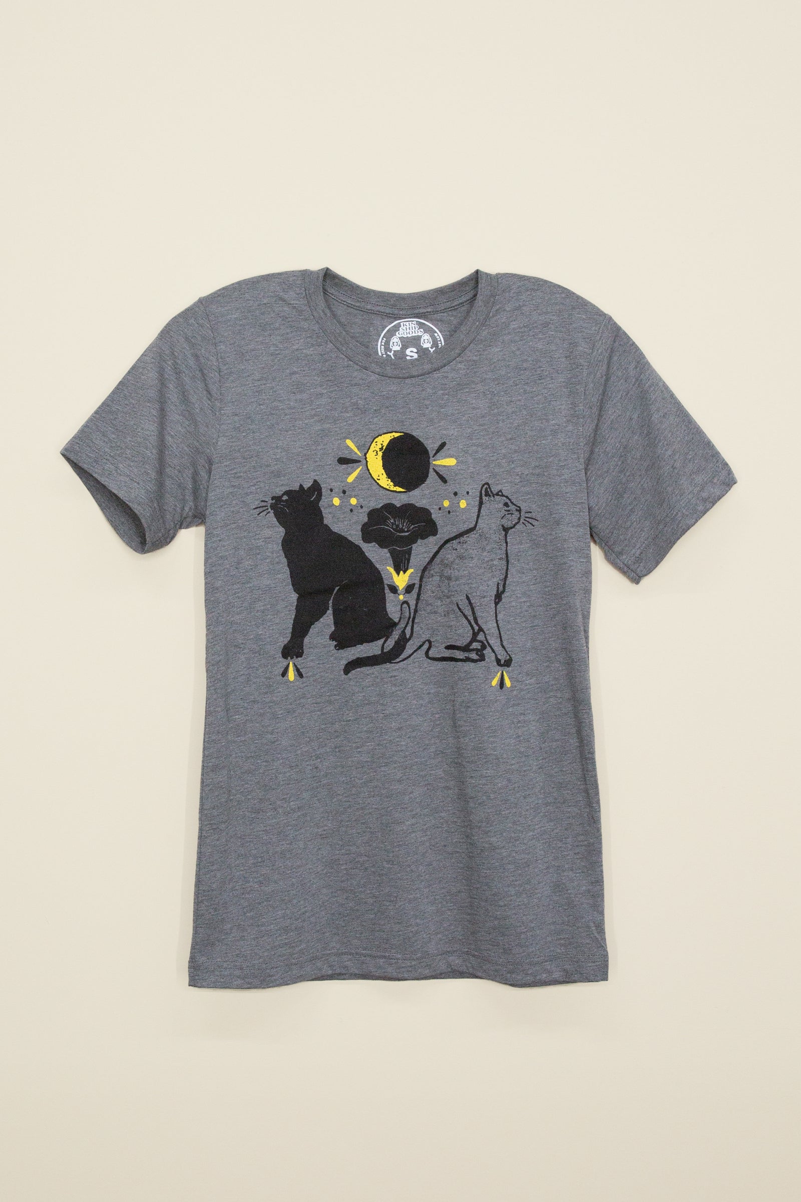 Kin Ship Goods heather gray t-shirt with two cats, moon phases, and folk-inspired hex symbols for protection, strength, and healing.
