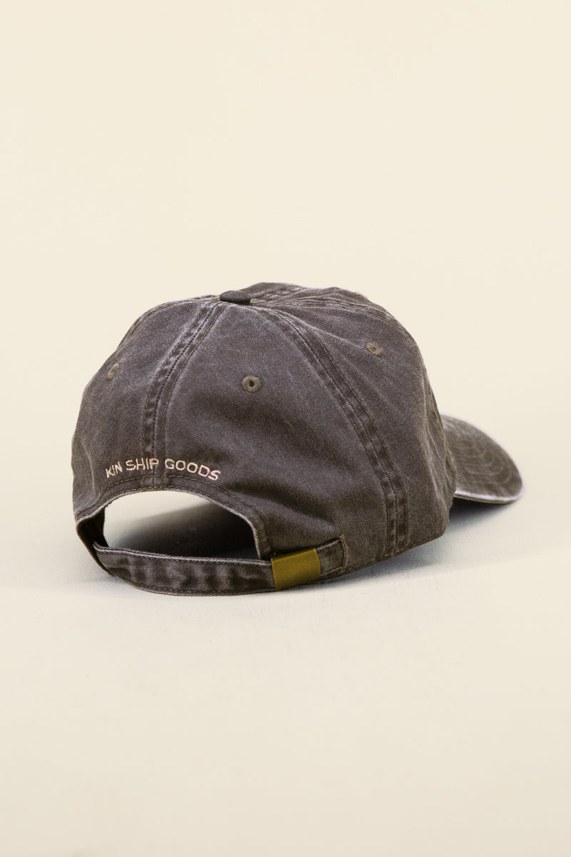 Kin Ship Goods brown lantern hat with tan embroidery—vintage-style dad cap with classic Appalachian lantern icon.

