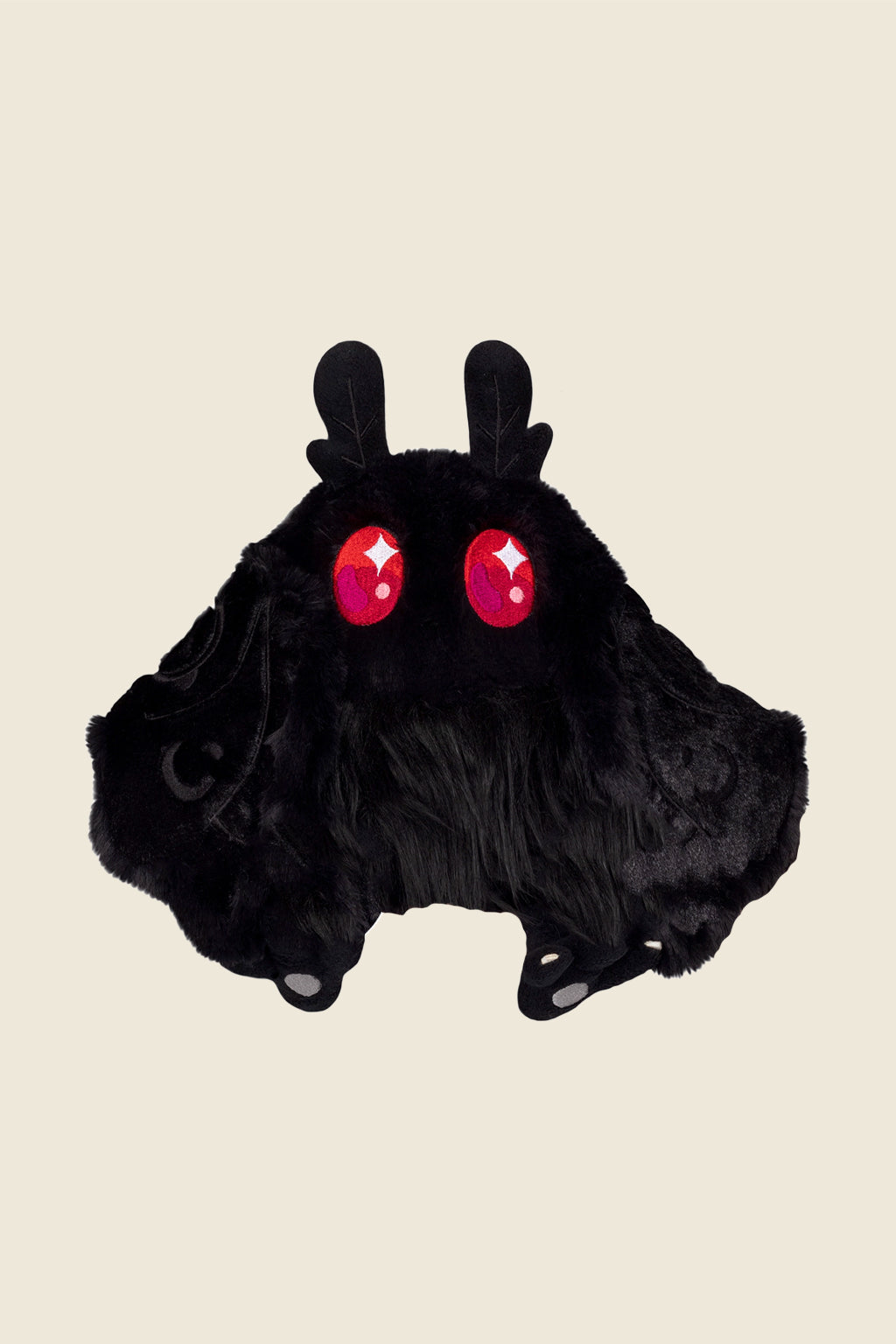 Black mothman plushie sold by Kin Ship Goods