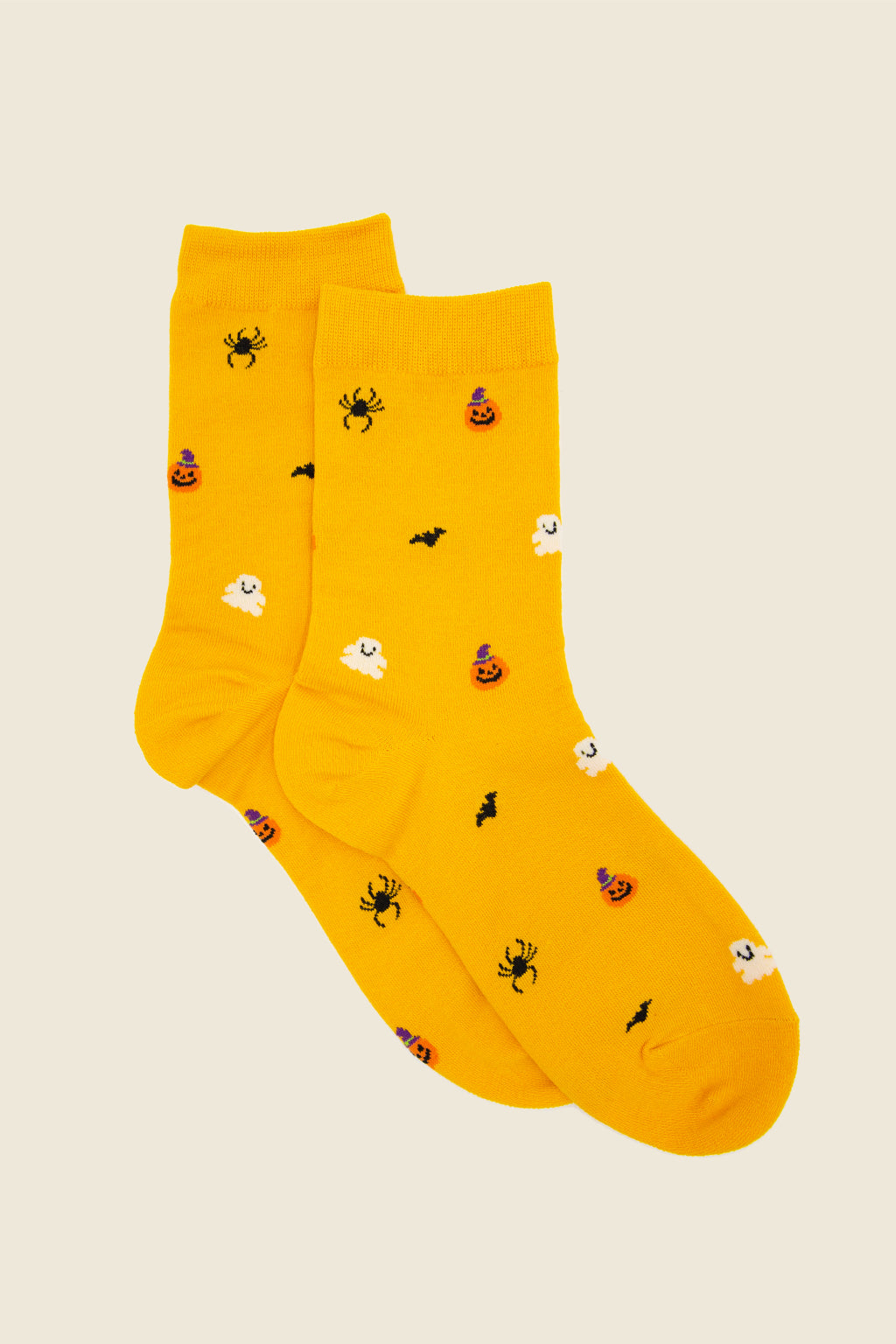 Kin Ship Goods Halloween socks with pumpkins, ghosts, bats, and spiders on yellow background