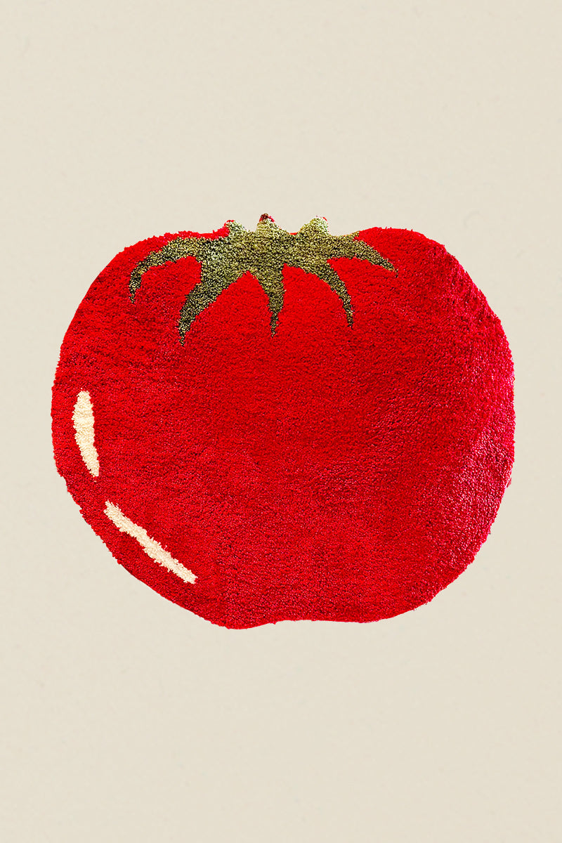 Kin Ship Goods tomato-shaped rug with green stem and white highlight detail