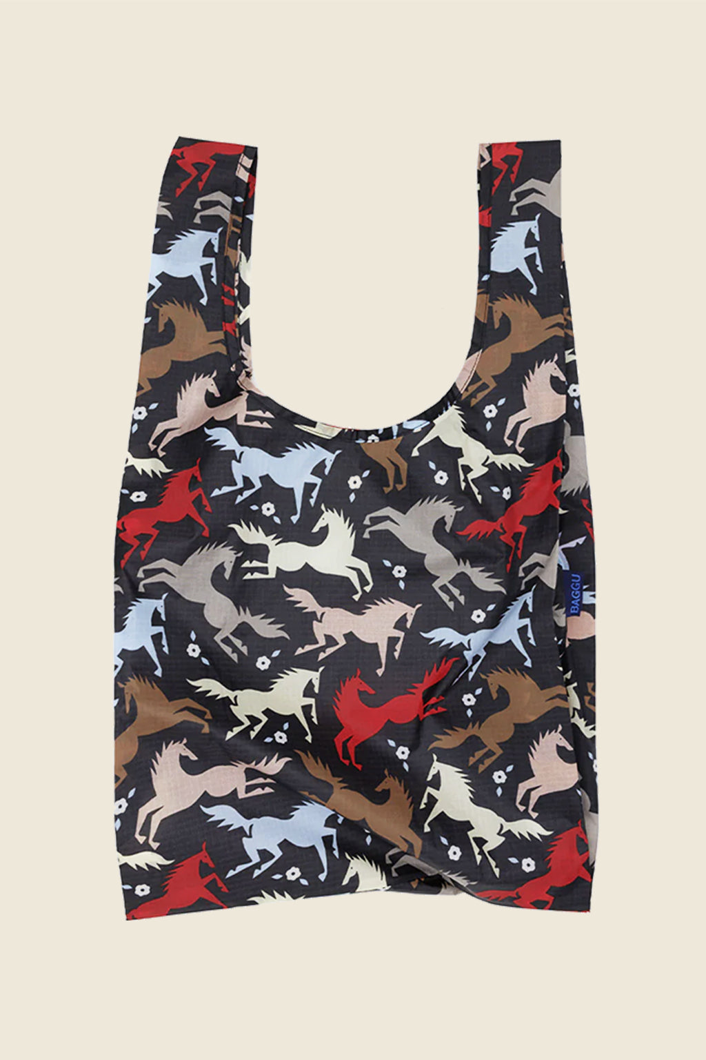 Kin Ship Goods horse print Baggu tote with galloping horses in red, tan, blue, and cream on a black reusable shopping bag.